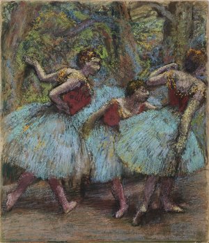 Photo de Trois danseuses en jupes bleues et corsages rouges 