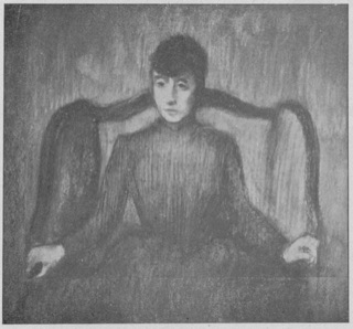 Femme assise dans un fauteuil.